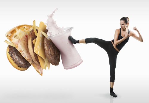 Photo of woman kicking junk food before appointment at Masci, Hale & Wilson Advanced Aesthetic and Restorative Dentistry in Montgomery, NY